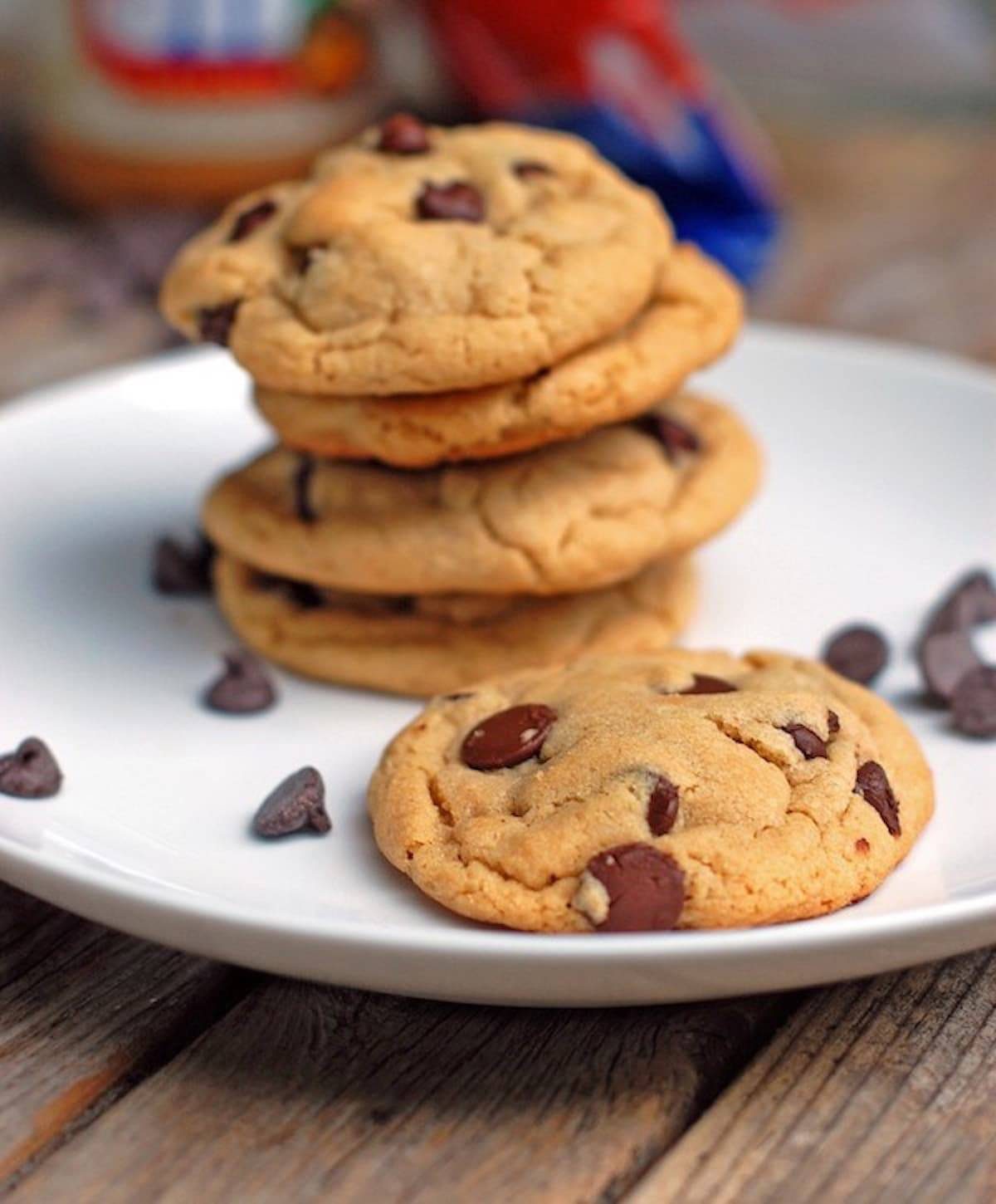 Peanut Butter Chocolate Chip cookies on a plate with chocolate chips.