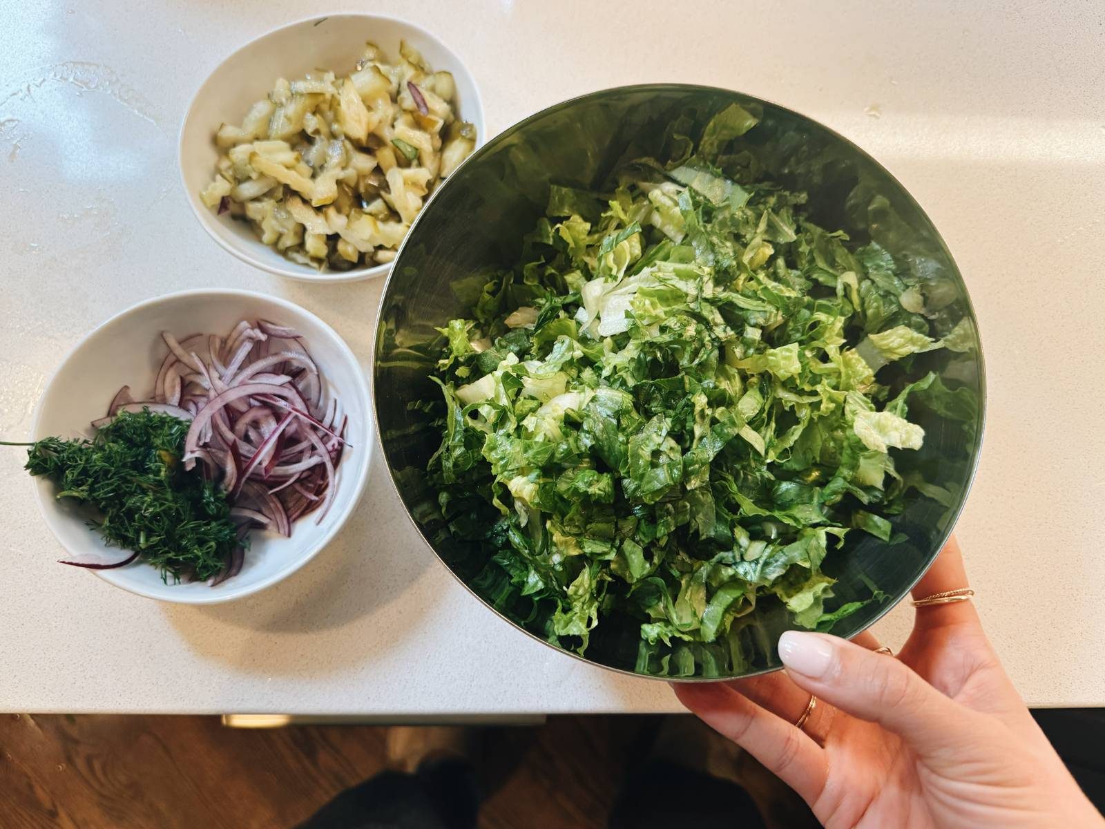 Chopped salad ingredients in bowls.