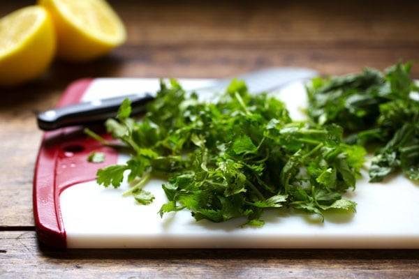 Herbs on a cutting board.