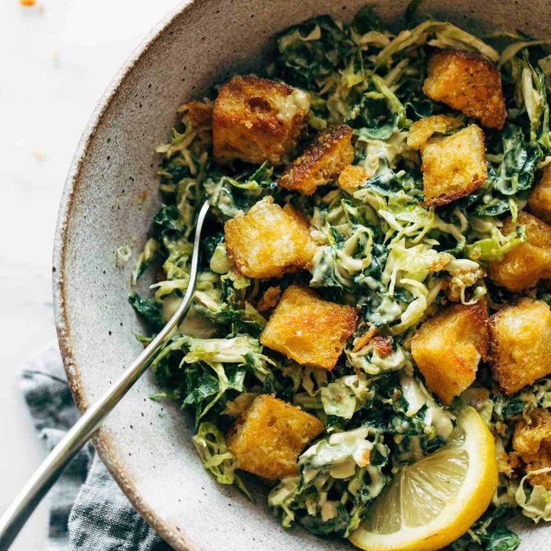 A picture of Brussels & Kale Caesar with Cheezy Garlic Croutons
