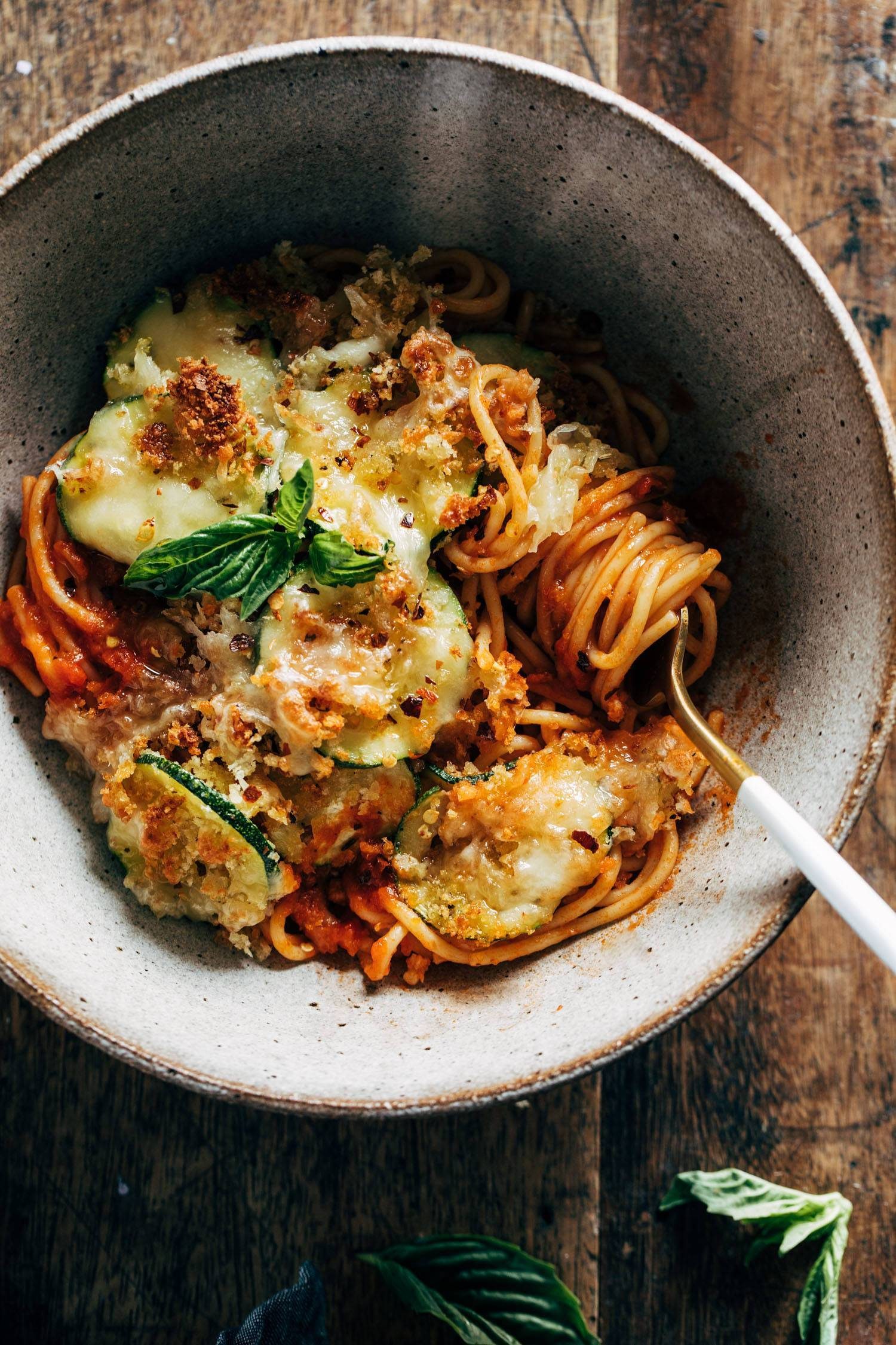 Spaghetti with crispy zucchini on top.