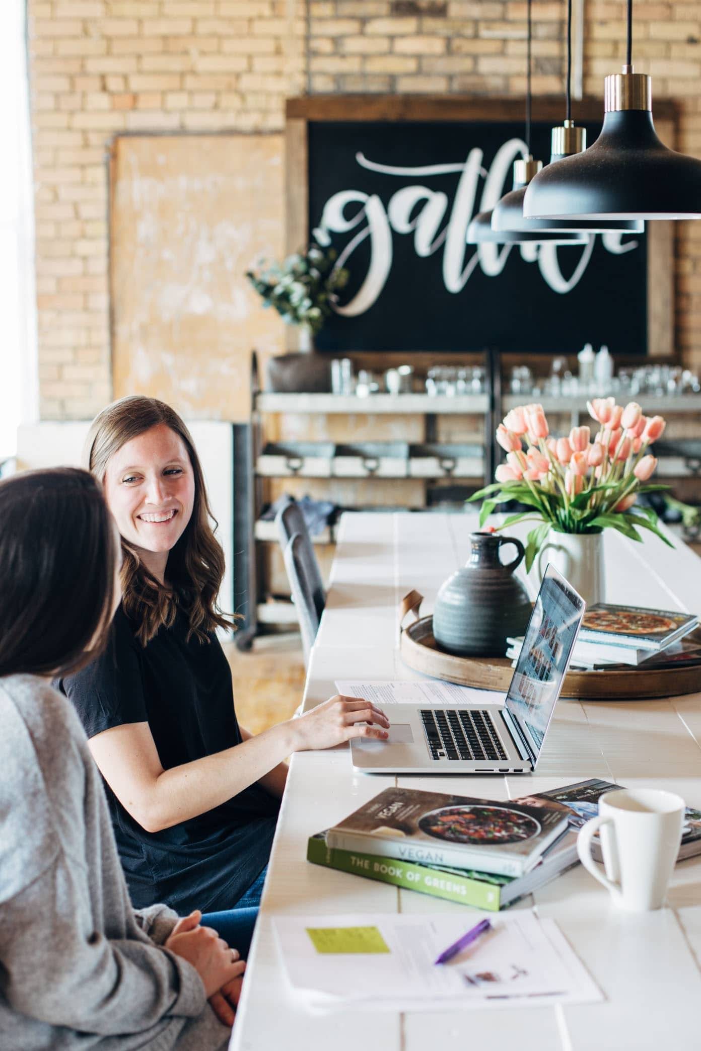 Women sitting at a table working together.