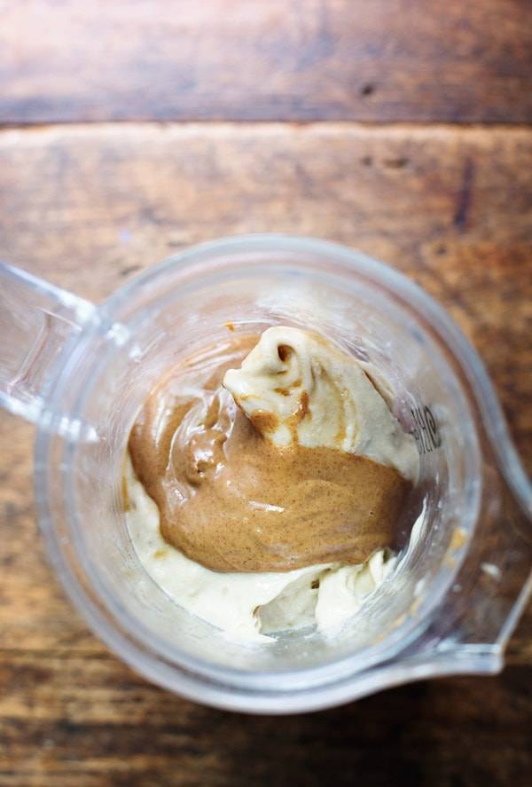 Peanut butter and frozen bananas in a blender.