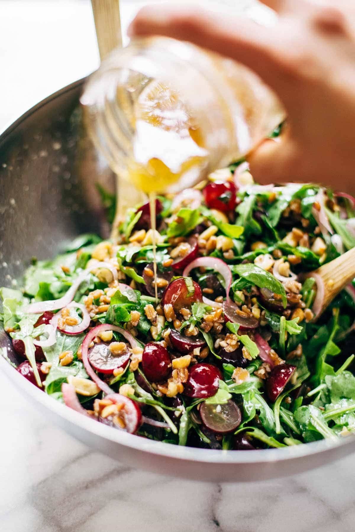 This Arugula Salad has grapes, cashews, pickled red onions, and a simple black pepper vinaigrette. Vegan, vegetarian, gluten free. | pinchofyum.com This Arugula Salad has grapes, cashews, pickled red onions, and a simple black pepper vinaigrette. Vegan, vegetarian, gluten free. | pinchofyum.com