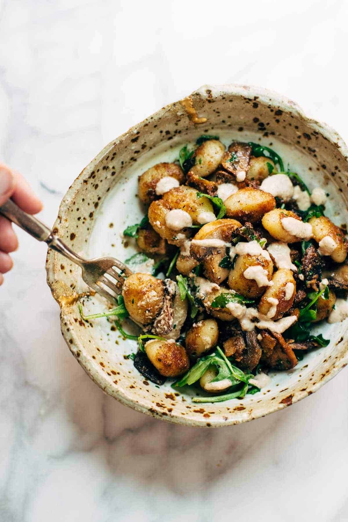 Mushroom Gnocchi with Walnut Pesto and Arugula - a vegetarian bowl that's made with familiar ingredients. Comes together in 30 minutes or less! | pinchofyum.com Mushroom Gnocchi with Walnut Pesto and Arugula - a vegetarian bowl that's made with familiar ingredients. Comes together in 30 minutes or less! | pinchofyum.com