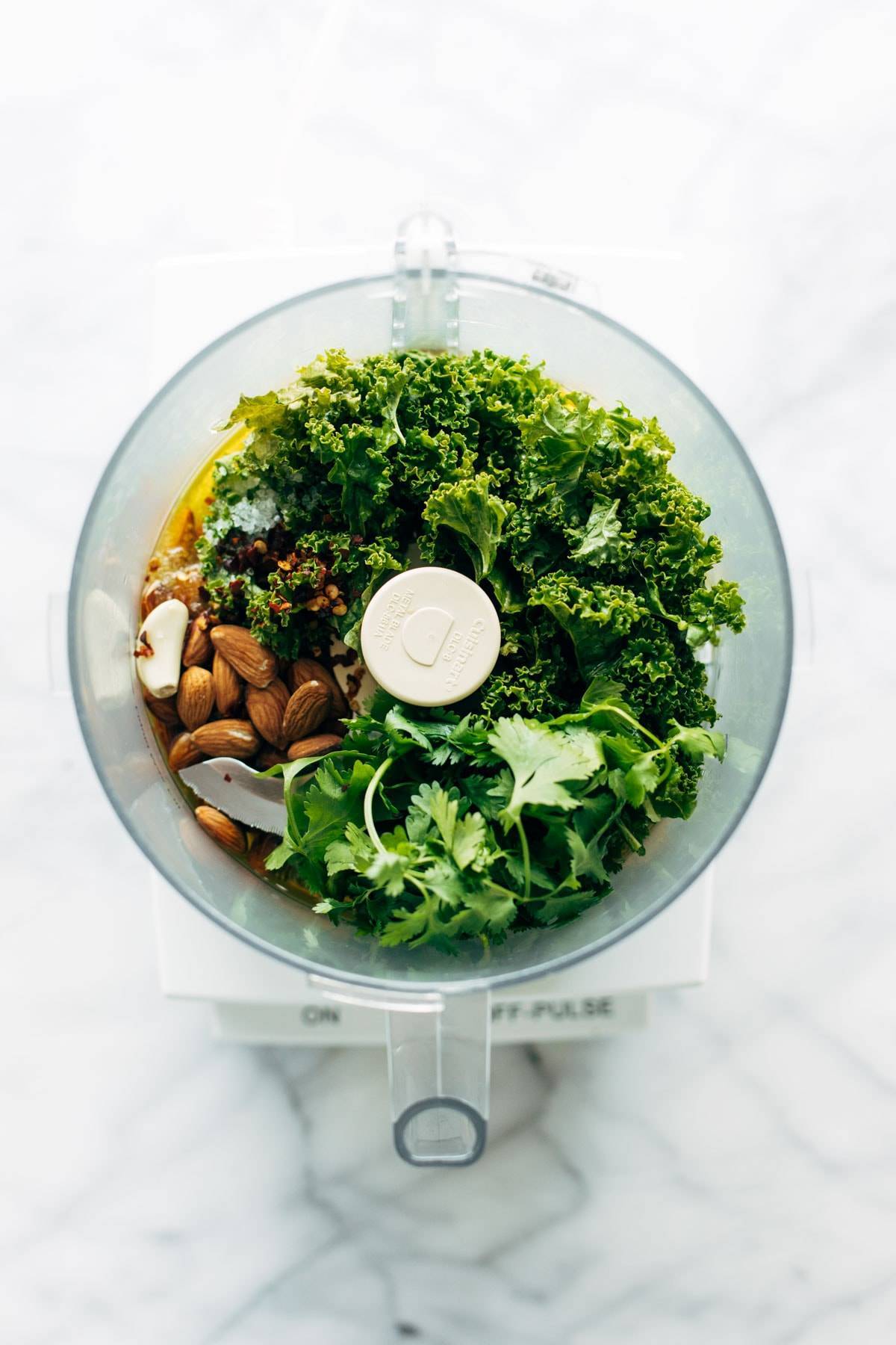 Ingredients for kale Chimichurri in a blender.